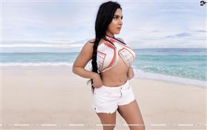 Ramya Inti flaunts her figure in white shorts at the sea-shore